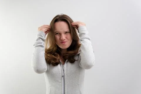 Negative emotion of adolescence brain explosion girl with her hands shows how it Stock Photos