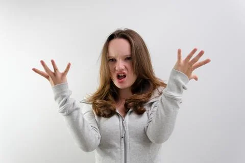 Negative emotion of adolescence brain explosion girl with her hands shows how it Stock Photos