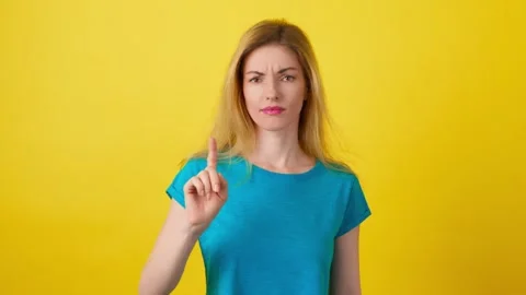 Negative feedback index and thumbs down by woman for review, emoji. Nervous upse Stock Footage 244918968