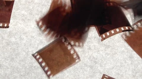 Negative film pieces fall Stock Footage 1079386