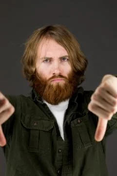 Negative model showing thumbs down Stock Photos