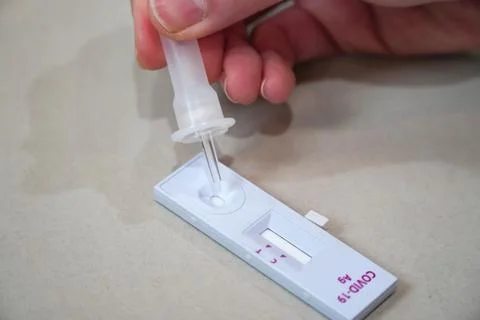 Negative test result using home screening machine for COVID-19 Stock Photos