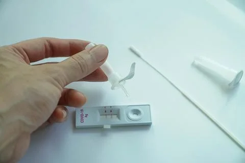 Negative test result using home screening machine for COVID-19 Stock Photos