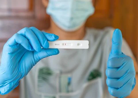 Negative test result by using rapid test device for COVID-19. Stock Photos