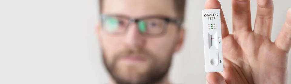 Negative test result by using rapid test device for COVID-19. Stock Photos