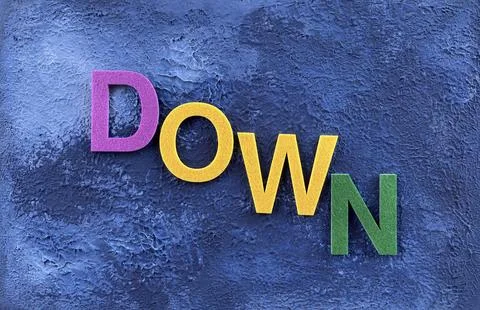 Negative Trend or Decline Concept with DOWN Text on Textured Background Stock Photos