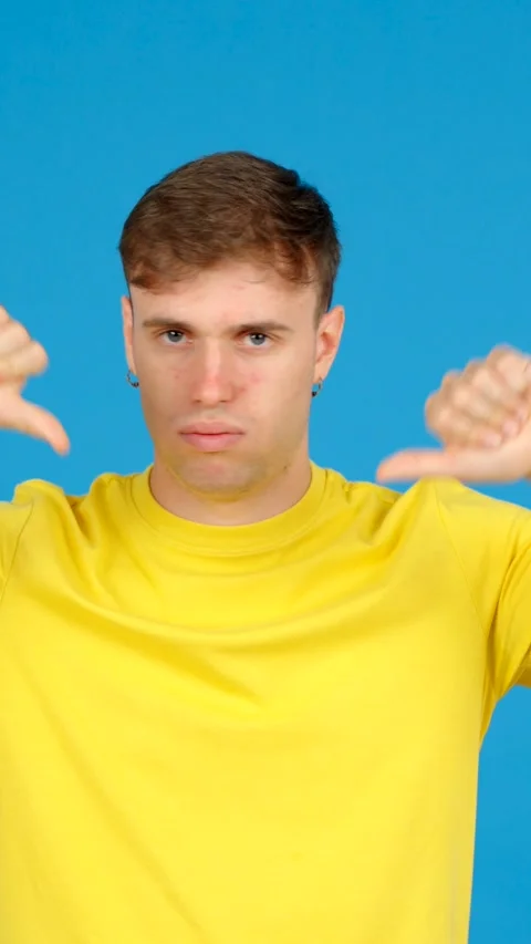 Negative young man showing thumbs down Stock Footage 254458271