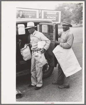 Negro farmer with supplies and freshly pressed suit, Saturday afternoon, S... Stock Photos