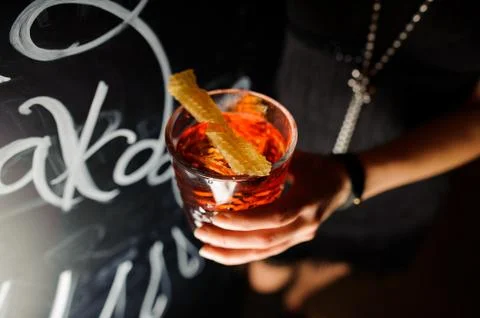 Negroni in the hand. Close up 스톡 사진