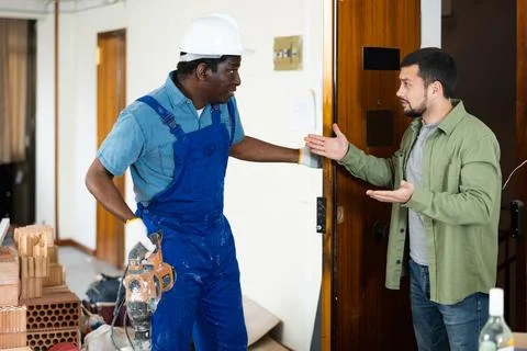 Neighbor complaining about noise to builder Stock Photos