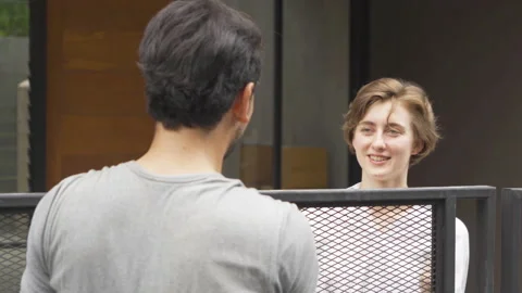 A neighbor talking to each other, making a conversation in their homes in vil Stock Footage 191565845