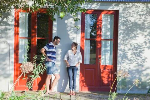 Neighbours chatting outside duplex Stock Photos