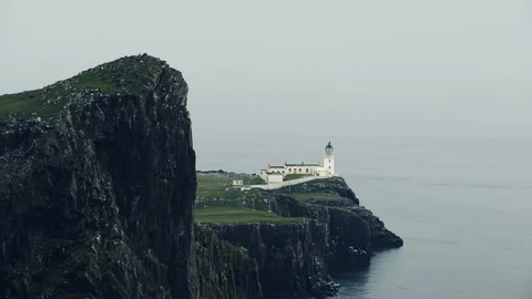 Neist point lighthouse on the cliffs Isle of Skye, Scotland, - Tilt Down Video stock 91832351
