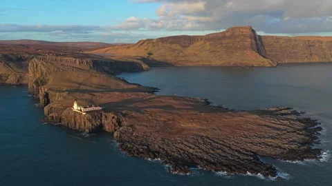 Neist point lighthouse on the isle of skye in scotland at sunset Stock Footage 334059483