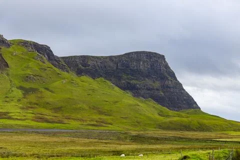 Neist Point at sunset, lighthouse, dramatic cliffs. Isle of Skye Stock Photos