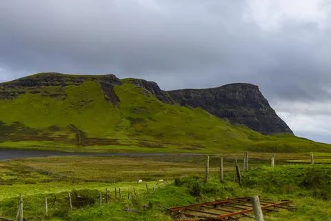 Neist Point at sunset, lighthouse, dramatic cliffs. Isle of Skye Stock Photos
