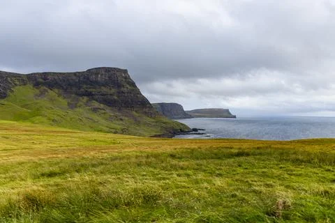 Neist Point at sunset, lighthouse, dramatic cliffs. Isle of Skye Stock Photos