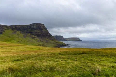 Neist Point at sunset, lighthouse, dramatic cliffs. Isle of Skye Stock Photos