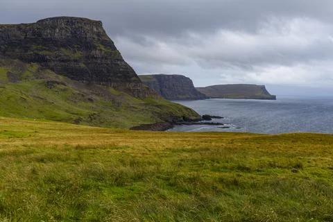 Neist Point at sunset, lighthouse, dramatic cliffs. Isle of Skye Stock Photos