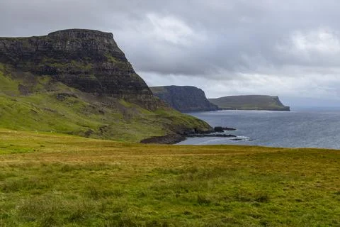 Neist Point at sunset, lighthouse, dramatic cliffs. Isle of Skye Stock Photos