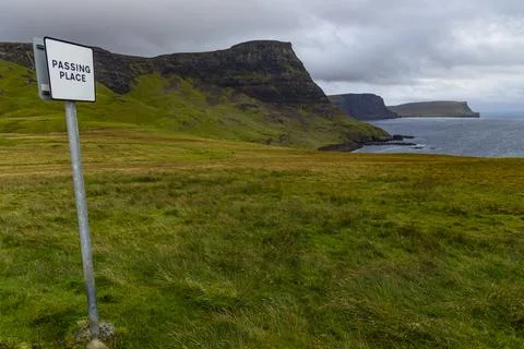 Neist Point at sunset, lighthouse, dramatic cliffs. Isle of Skye Stock Photos