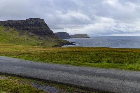Neist Point at sunset, lighthouse, dramatic cliffs. Isle of Skye Stock Photos