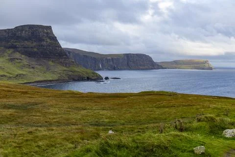 Neist Point at sunset, lighthouse, dramatic cliffs. Isle of Skye Stock Photos