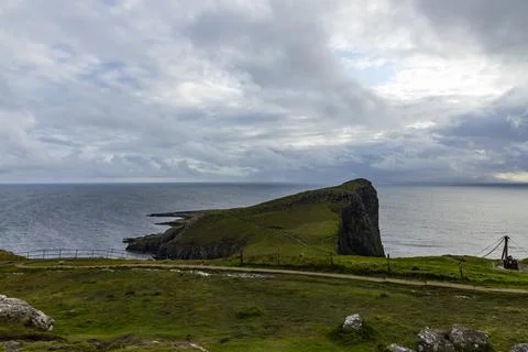 Neist Point at sunset, lighthouse, dramatic cliffs. Isle of Skye Stock Photos