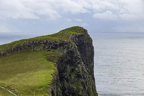 Neist Point at sunset, lighthouse, dramatic cliffs. Isle of Skye Stock Photos