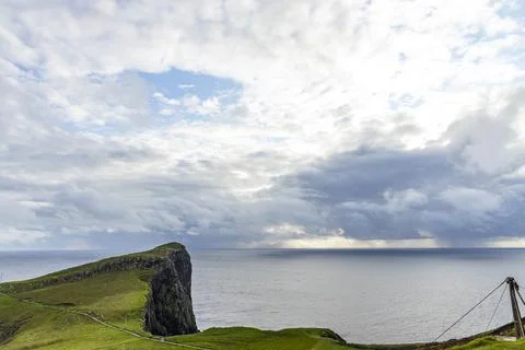 Neist Point at sunset, lighthouse, dramatic cliffs. Isle of Skye Stock Photos