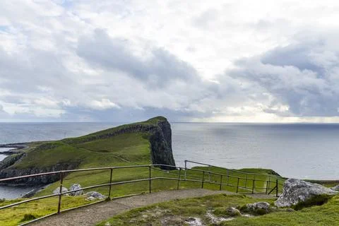 Neist Point at sunset, lighthouse, dramatic cliffs. Isle of Skye Stock Photos
