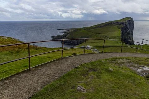Neist Point at sunset, lighthouse, dramatic cliffs. Isle of Skye Stock Photos