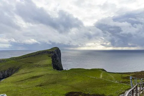 Neist Point at sunset, lighthouse, dramatic cliffs. Isle of Skye Stock Photos