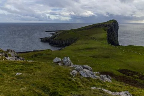 Neist Point at sunset, lighthouse, dramatic cliffs. Isle of Skye Stock Photos