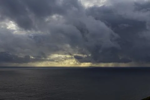 Neist Point at sunset, lighthouse, dramatic cliffs. Isle of Skye Stock Photos