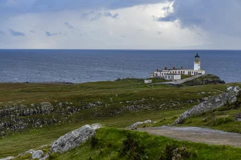 Neist Point at sunset, lighthouse, dramatic cliffs. Isle of Skye Stock Photos