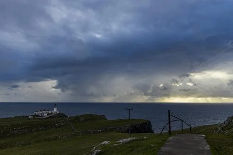 Neist Point at sunset, lighthouse, dramatic cliffs. Isle of Skye Stock Photos