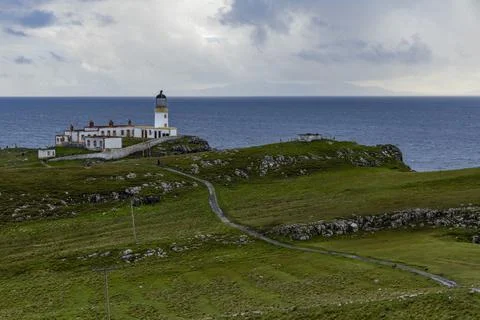 Neist Point at sunset, lighthouse, dramatic cliffs. Isle of Skye Stock Photos