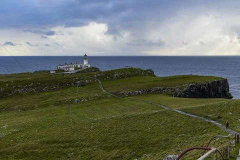 Neist Point at sunset, lighthouse, dramatic cliffs. Isle of Skye Stock Photos