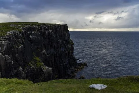 Neist Point at sunset, lighthouse, dramatic cliffs. Isle of Skye Stock Photos