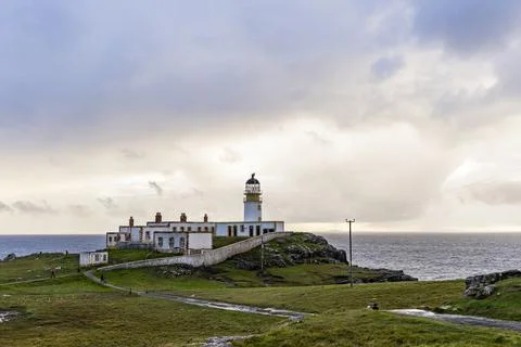 Neist Point at sunset, lighthouse, dramatic cliffs. Isle of Skye Stock Photos