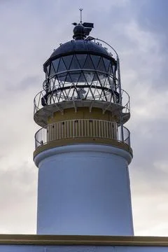 Neist Point at sunset, lighthouse, dramatic cliffs. Isle of Skye Stock Photos