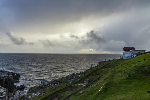 Neist Point at sunset, lighthouse, dramatic cliffs. Isle of Skye Stock Photos