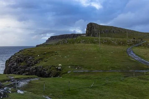 Neist Point at sunset, lighthouse, dramatic cliffs. Isle of Skye Foto stock