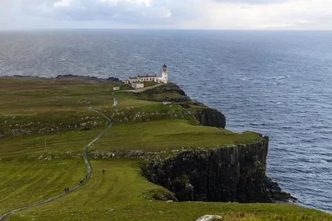 Neist Point at sunset, lighthouse, dramatic cliffs. Isle of Skye Stock Photos