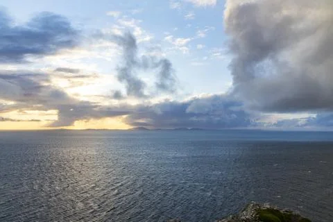 Neist Point at sunset, lighthouse, dramatic cliffs. Isle of Skye Stock Photos