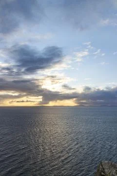 Neist Point at sunset, lighthouse, dramatic cliffs. Isle of Skye Stock Photos
