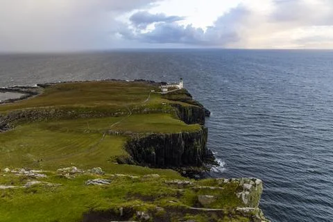 Neist Point at sunset, lighthouse, dramatic cliffs. Isle of Skye Stock Photos