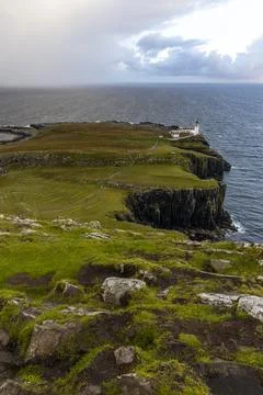 Neist Point at sunset, lighthouse, dramatic cliffs. Isle of Skye Stock Photos