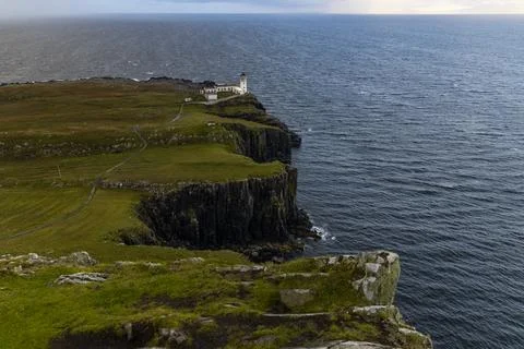 Neist Point at sunset, lighthouse, dramatic cliffs. Isle of Skye Stock Photos